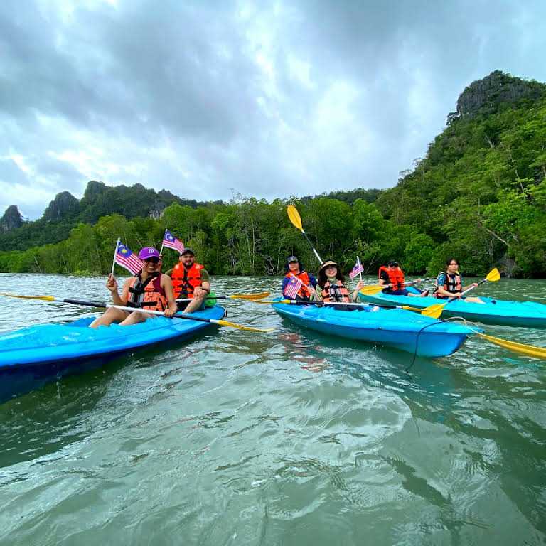 Tourists posing for photo on Mangrove Kayaking tour Langkawi